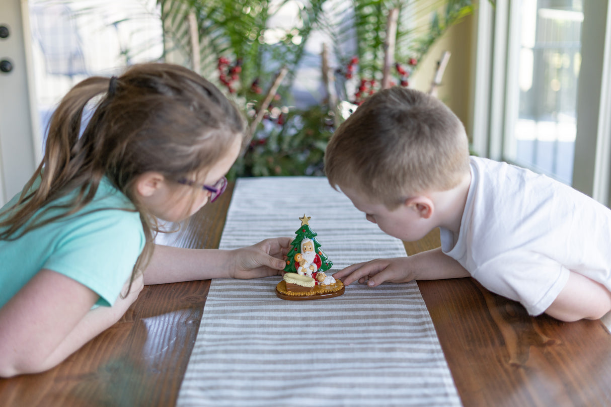 Santa Praying with Jesus by Christmas Tree