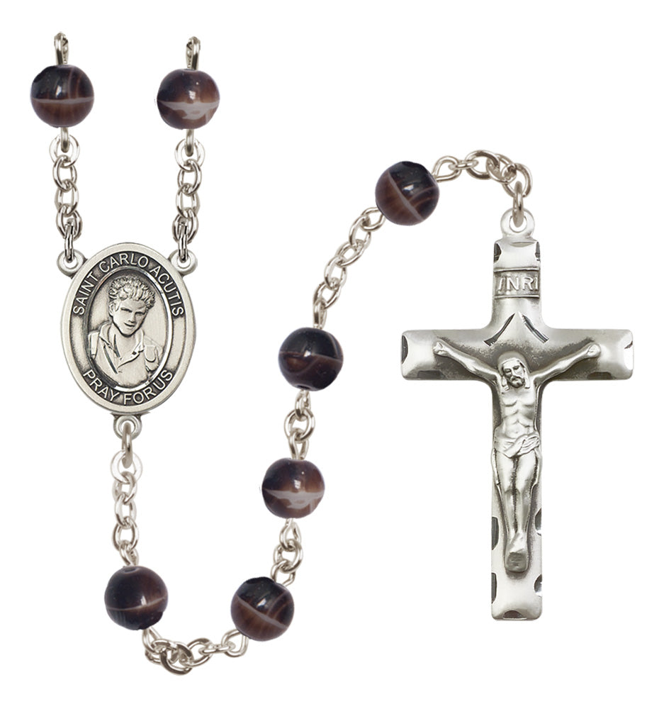 Rosary with brown beads and silver cross on a white background