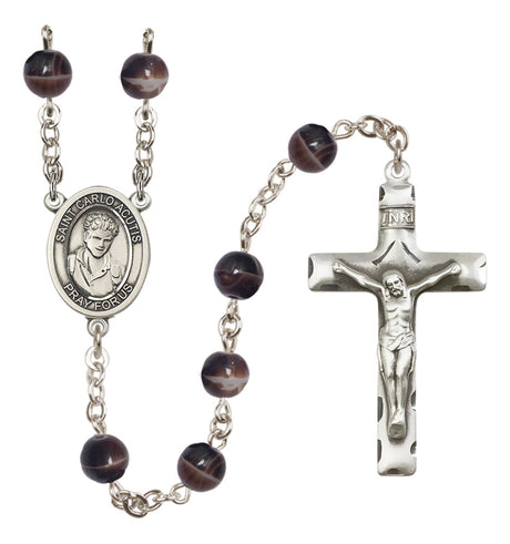 Rosary with brown beads and silver cross on a white background