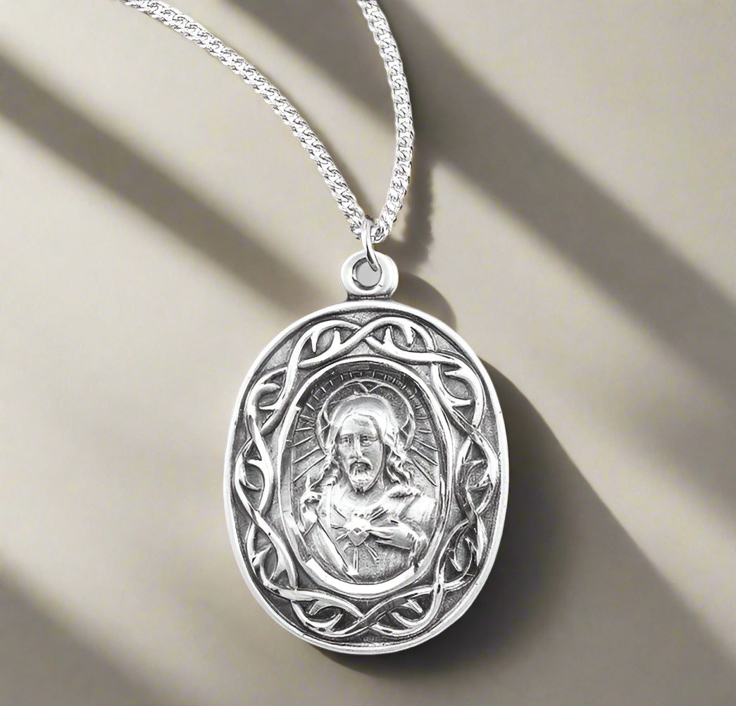oval crown of thorns border sacred heart of Jesus sterling silver medal