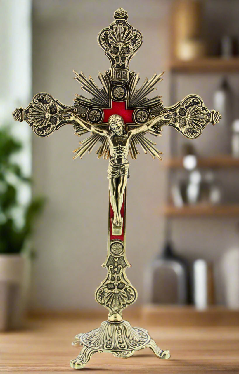 Gold tone with red accents standing crucifix