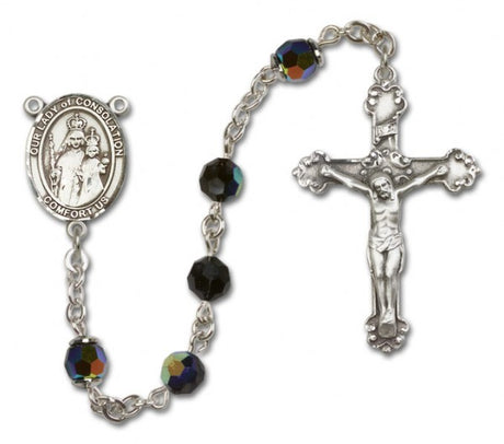 A sterling silver Our Lady of Consolation Rosary featuring a fancy crucifix and beads with a multicolor reflective finish.