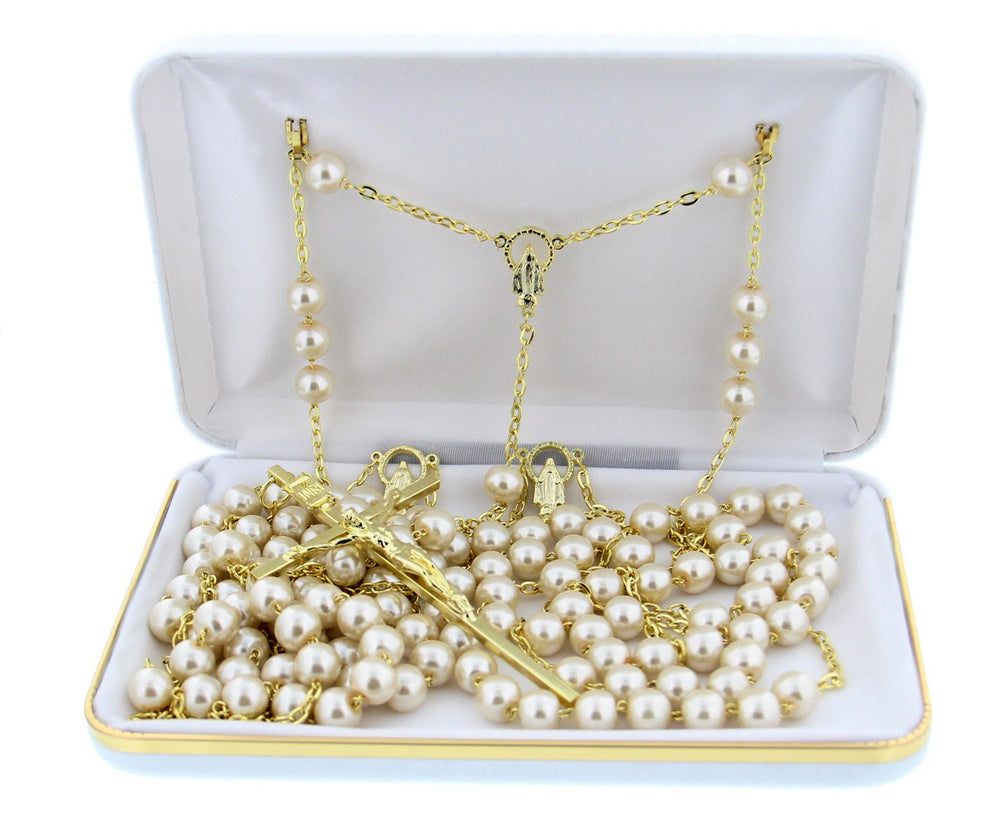 Pearl lasso wedding rosary with gold tone accents draped in a figure eight