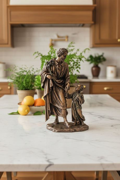 Bronze statue of a man and a child holding hands on a white background