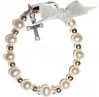Baptism Gift Ideas - a baby bracelet with dangle cross.